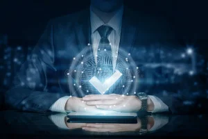 businessman sitting quality sign system front him table digital hanging above device blurred background 137536796